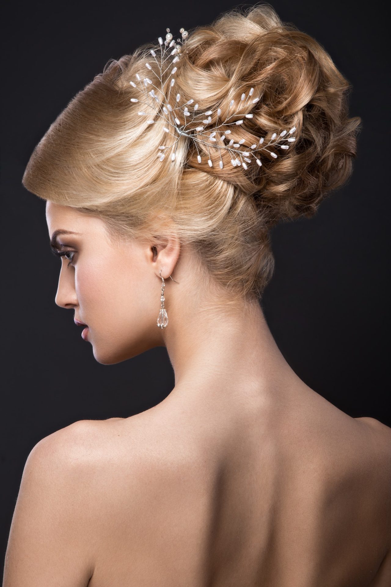 beautiful-blond-girl-with-perfect-skin-evening-make-up-wedding-hairstyle-and-accessories-.jpg